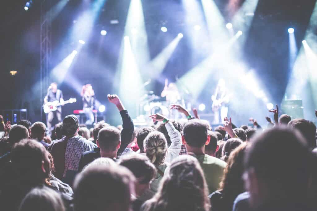 A band is performing in front of the crowd.