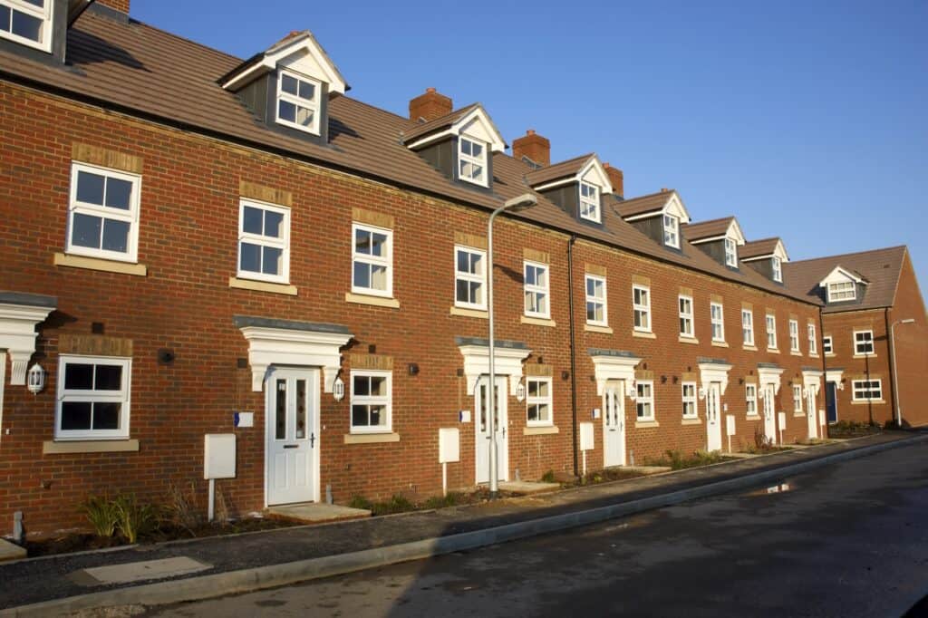 Newly built brick houses in the concept of affordable housing options in Sutton.