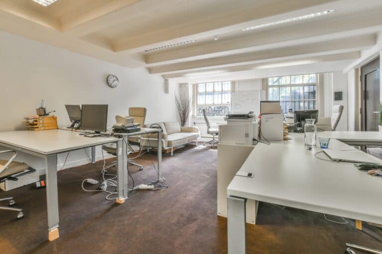A big office with computers and desks in the concept of 'factors influencing the cost of office removals in Sutton'.