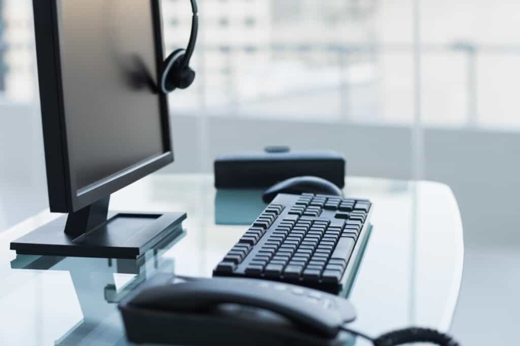 A cropped image of an office desk after office hours in the concept of 'how do office removals services operate in Sutton'.