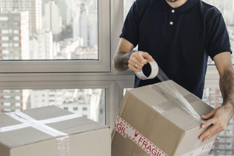 Cropped image of a professional mover packing in the office in the concept of 'Benefits of Hiring a Professional Office Removal Service'.