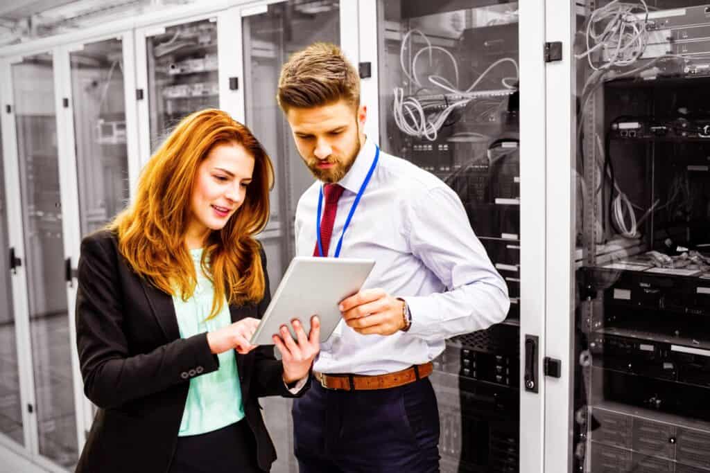 Engineers analysing servers in the server room